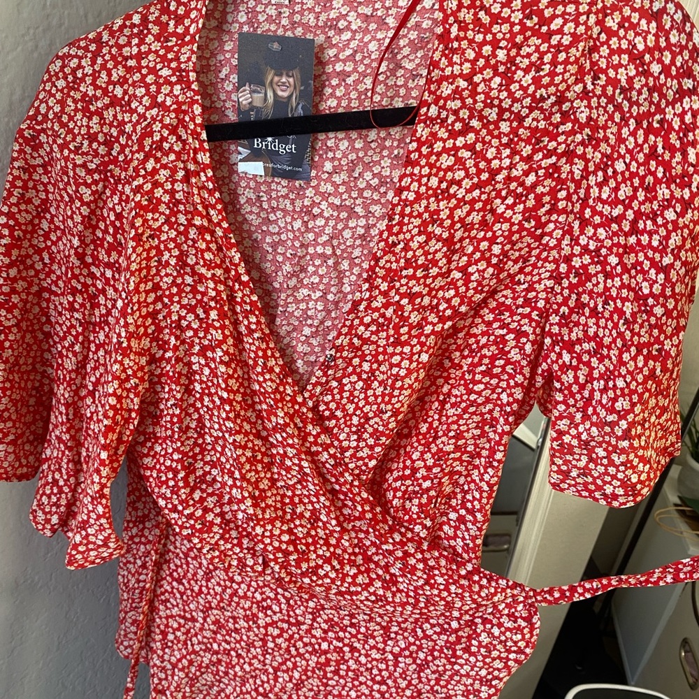 Red blouse with white flowers
